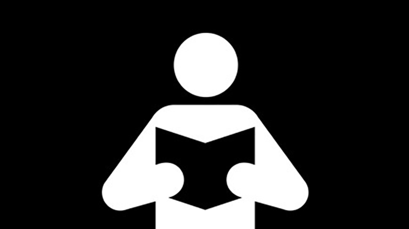 Man of Men reading a book