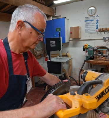 Kevin mens shed sawing wood.jpg