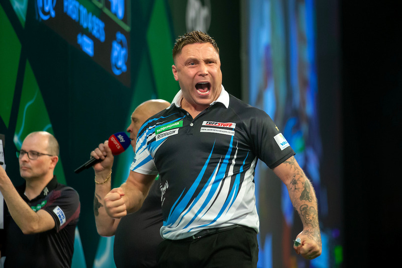 Darts player Gerwyn Price pumps his fist in celebration during a match at Alexandra Palace.