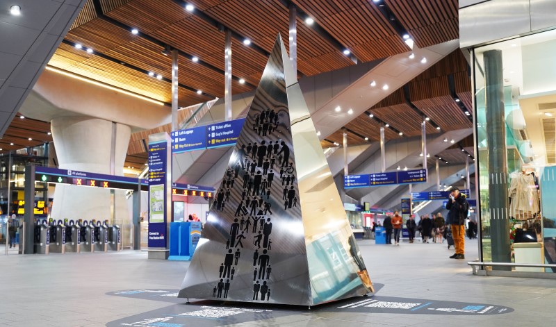 The Prostate Cancer Memorial at London Bridge Station, featuring the Prostate Cancer UK Man of Men symbol.