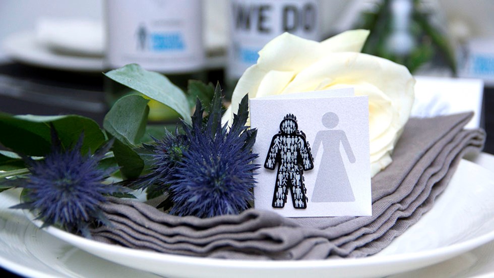 Some wedding flowers with a Prostate Cancer UK 'Man of Men' badge