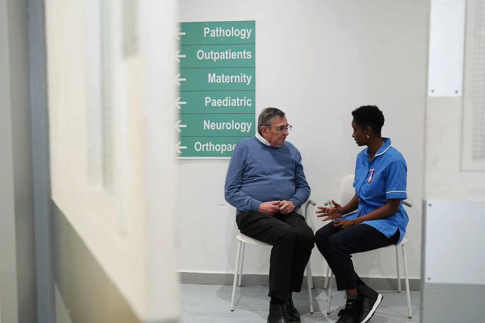 Man And Nurse Talking
