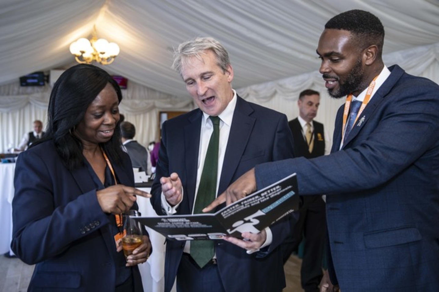 Doris Olulode, Damien Hinds MP for East Hampshire and Keith Morgan discussing Prostate Cancer UK's Faster Fairer Better report