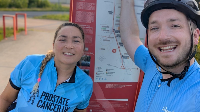 A man and a woman wearing Prostate Cancer UK cycling gear