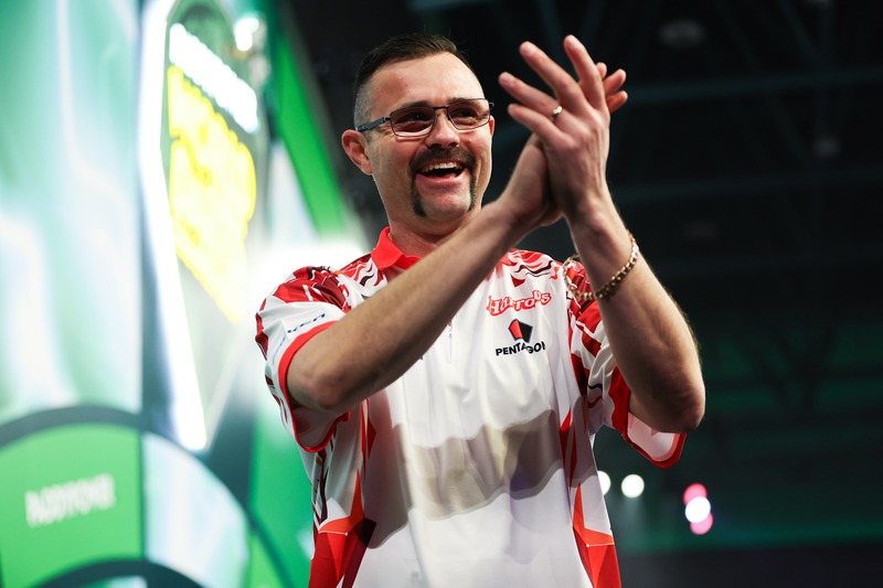 Australian Damon Heta applauds the crowd after landing the second nine-darter of the tournament