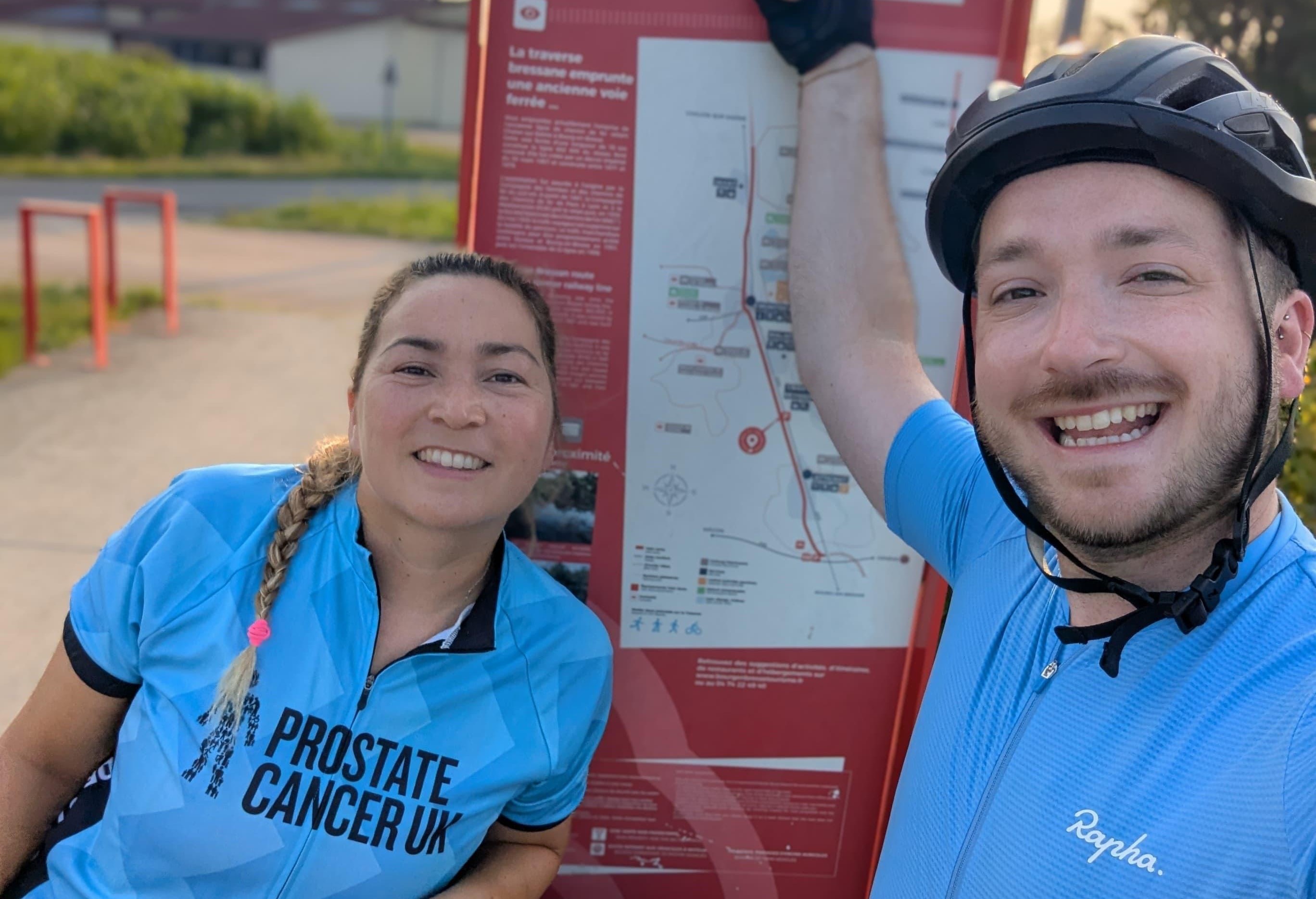 A man and a woman wearing Prostate Cancer UK cycling gear