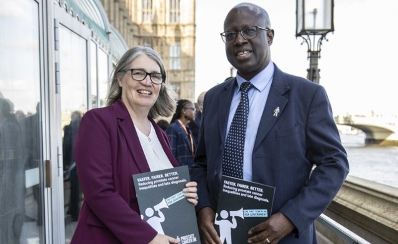 Laura Kerby, CEO of Prostate Cancer UK, and Prof Frank Chinegwundoh MBE, with the Faster Fairer Better report at the Houses of Parliament