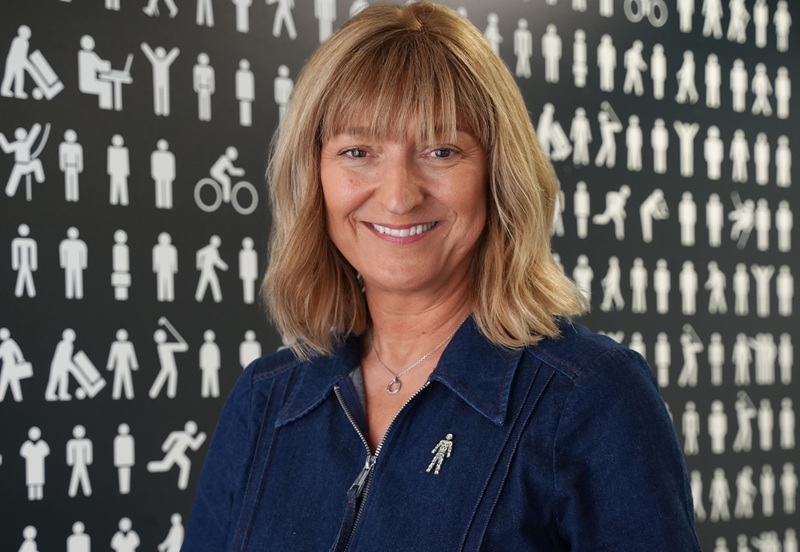 Sharon Pavitt wearing the Prostate Cancer UK 'Man of Men' badge