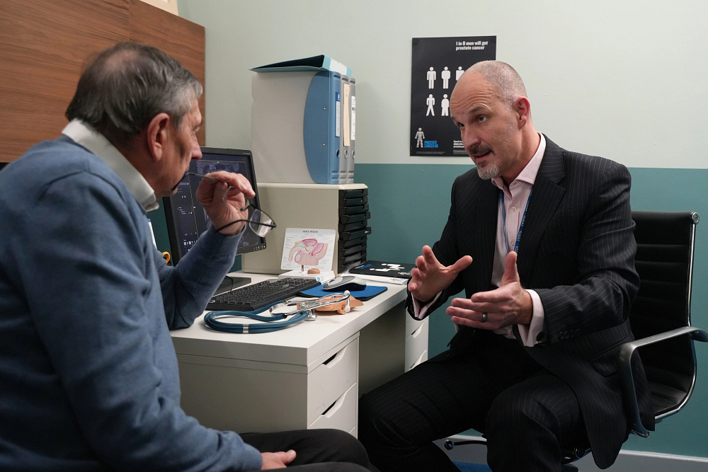 Man and GP talking about prostate cancer treatments